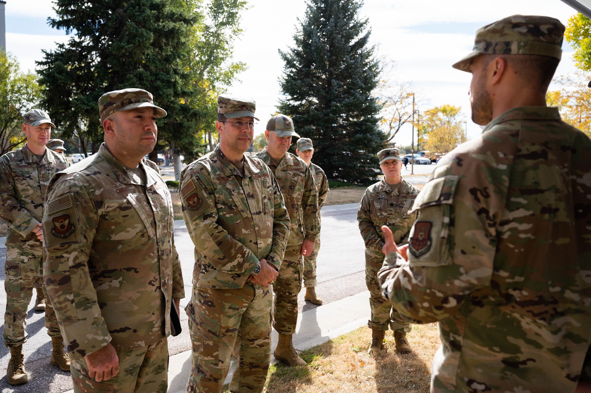 Maj. Gen. Andrew Gebara, center, 8th Air Force and Joint-Global Strike Operations Center commander, and Chief Master Sgt. Steve Cenov, left, 8th Air Force command chief and J-GSOC senior enlisted leader, are briefed by a member of the 28th Bomb Wing at Ellsworth Air Force Base, S.D., Oct. 17, 2022. The Mighty Eighth leadership team connected with Airmen across Ellsworth gaining insight into projects supporting the future arrival of the B-21 Raider. (U.S. Air Force photo by Staff Sgt. Alexi Bosarge)