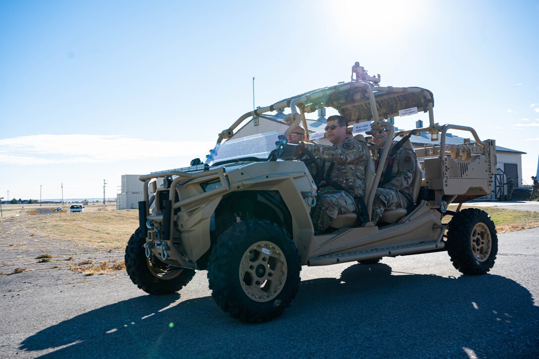 Maj. Gen. Andrew Gebara, 8th Air Force and Joint-Global Strike Operations Center commander, and 28th Bomb Wing leadership ride a utility terrain vehicle during his visit at Ellsworth Air Force Base, S.D., Oct. 17, 2022. Gebara commands the service’s bomber force and airborne nuclear command and control assets, and approximately 24,000 Airmen across six installations. (U.S. Air Force photo by Staff Sgt. Alexi Bosarge)