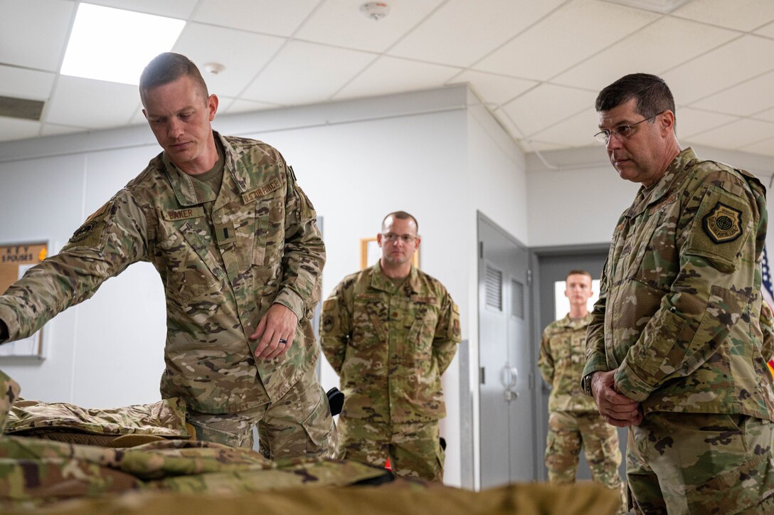 Maj. Gen. Andrew Gebara, right, 8th Air Force and Joint-Global Strike Operations Center commander, is briefed by a member of the 28th Bomb Wing at Ellsworth Air Force Base, S.D., Oct. 17, 2022. Gebara connected with Airmen across Ellsworth gaining insight into projects supporting the future arrival of the B-21 Raider. (U.S. Air Force photo by Staff Sgt. Alexi Bosarge)