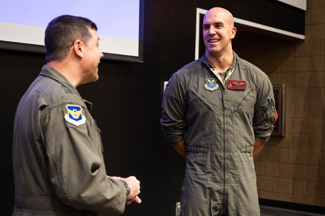 Capt. Jack Maliska, assigned to the 28th Bomb Wing, receives a coin from Maj. Gen. Andrew Gebara, 8th Air Force and Joint-Global Strike Operations Center commander, at Ellsworth Air Force Base, S.D., Oct. 17, 2022. Coining’s are traditionally used to reward and recognize service members for their exceptional work inside and outside of the workplace. (U.S. Air Force photo by Staff Sgt. Alexi Bosarge)