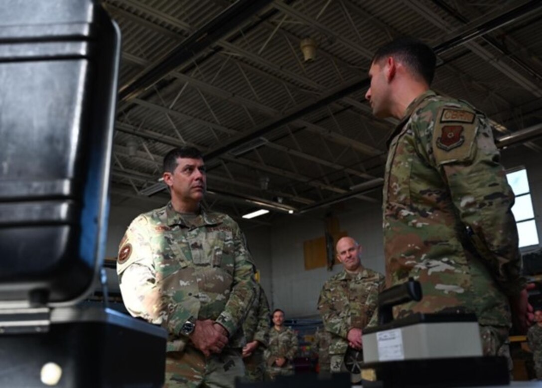 Maj. Gen. Andrew Gebara, 8th Air Force and Joint-Global Strike Operations Center commander, and Chief Master Sgt. Steve Cenov, 8th Air Force command chief and J-GSOC senior enlisted leader, are briefed by a member of the 28th Bomb Wing at Ellsworth Air Force Base, S.D., Oct. 17, 2022. Gebara connected with Airmen across Ellsworth gaining insight into projects supporting the future arrival of the B-21 Raider. (U.S. Air Force Photo by Airman Yendi Borjas)