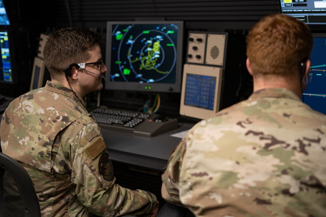 A photo of A1C Ean Holt and Staff Sgt. Brennan Gettinger at the ATC tower.