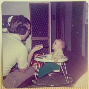 Keith Kirchner holds a microphone up for son Roger.