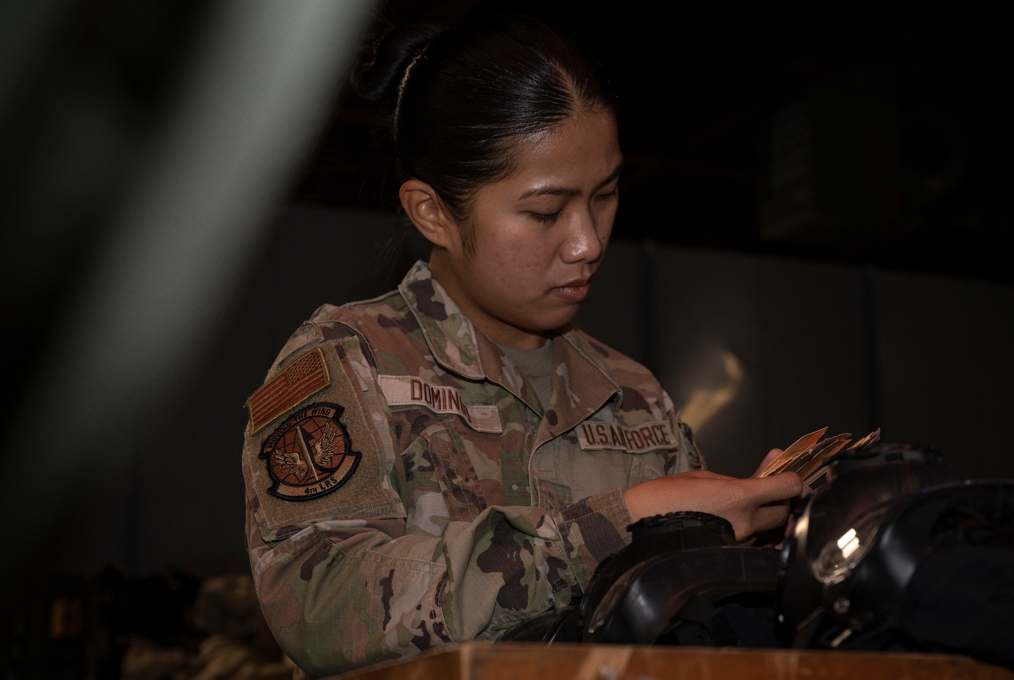 Airman 1st Class Lyka Domingo, 4th Logistics Readiness Squadron supply technician, ensures inventory of M-50 joint service general purpose masks, at Seymour Johnson Air Force Base, North Carolina, Oct. 20, 2022.  Members of the 4th LRS supply shop are responsible for operating supply systems and activities in order to provide necessary equipment and supplies for Seymour Johnson AFB. (U.S. Air Force photo by Airman 1st Class Sabrina Fuller)