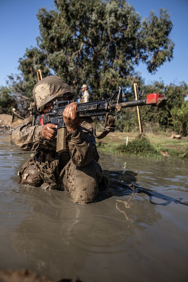 U.S. Marine Corps recruit with Delta Company, 1st Recruit Training Battalion, provides security during the Crucible at Camp Pendleton, California, Oct. 17, 2022. The Crucible is a 54-hour culminating event consisting of mentally and physically demanding challenges with limited food and sleep. (U.S. Marine Corps photo by Cpl. Pio)