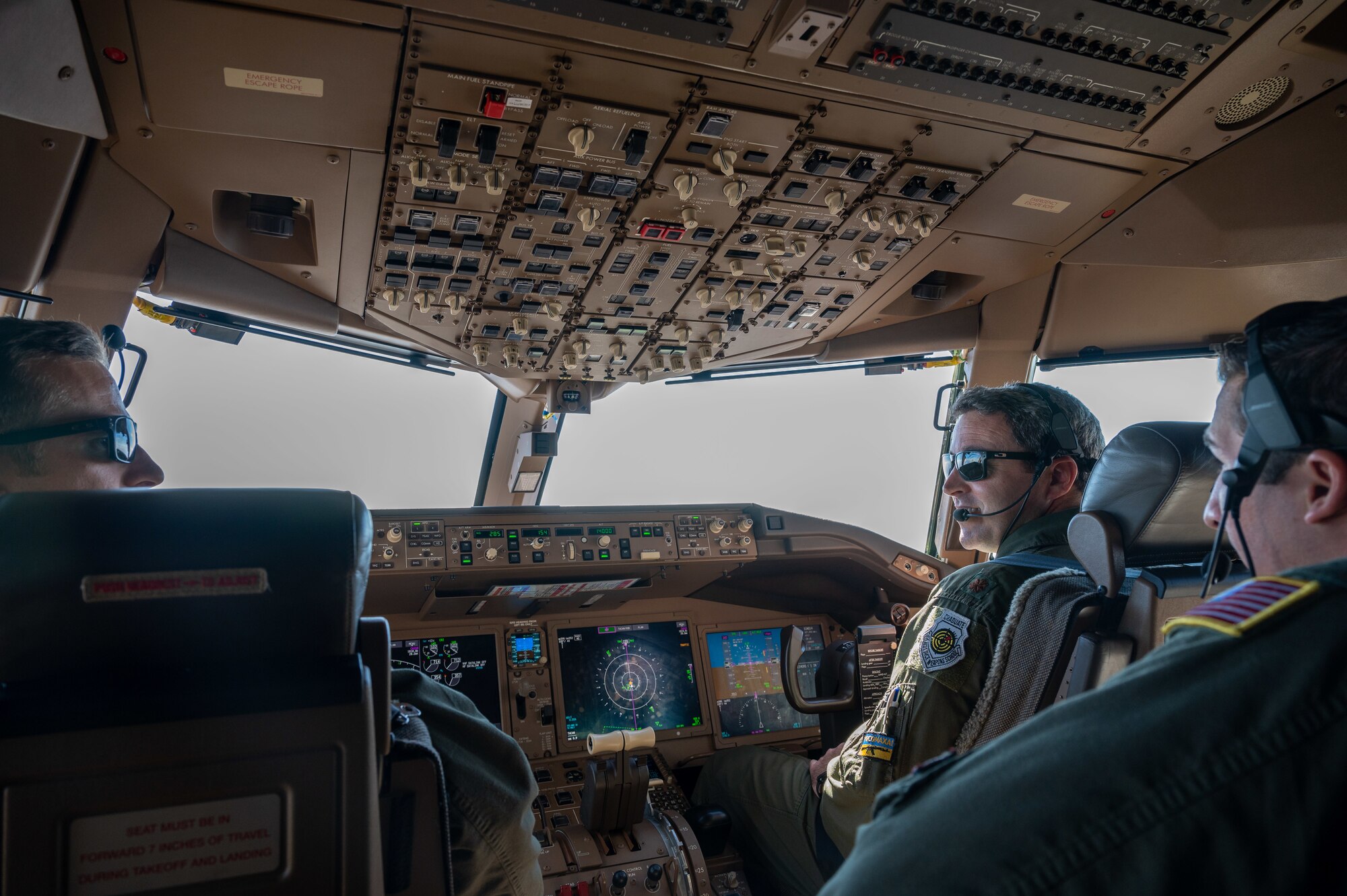 Major Luke Williams, 2nd Air Refueling Squadron pilot, Airman 1st Class Austin Cowin, 2nd ARS boom operator and Maj. Jonathan Avera, 344th ARS pilot, fly as part of a mixed crew on a KC-46A Pegasus to improve cohesion and training Oct. 19, 2022, at McConnell Air Force Base, Kansas.