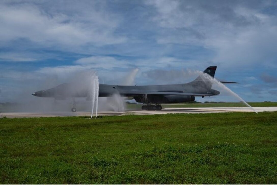A U.S. Air Force B-1B Lancer, assigned to the 37th Expeditionary Bomb Squadron, Ellsworth Air Force Base, South Dakota, taxis through a clean water wash station at Andersen Air Force Base, Guam, after arriving for a Bomber Task Force mission, Oct. 18, 2022. These missions provide an opportunity to train alongside our Allies and partners to demonstrate interoperability and bolster our collective ability to support a free and open Indo-Pacific. (U.S. Air Force photo by Staff Sgt. Hannah Malone)