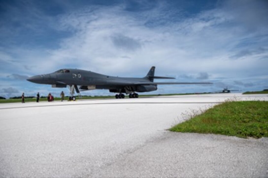 Two U.S. Air Force B-1B Lancers assigned to the 37th Expeditionary Bomb Squadron, Ellsworth Air Force Base, South Dakota, prepare to park at Andersen Air Force Base, Guam, Oct. 18, 2022. Bomber Task Force missions demonstrate lethality and interoperability in support of a free and open Indo-Pacific. (U.S. Air Force photo by Senior Airman Yosselin Campos)