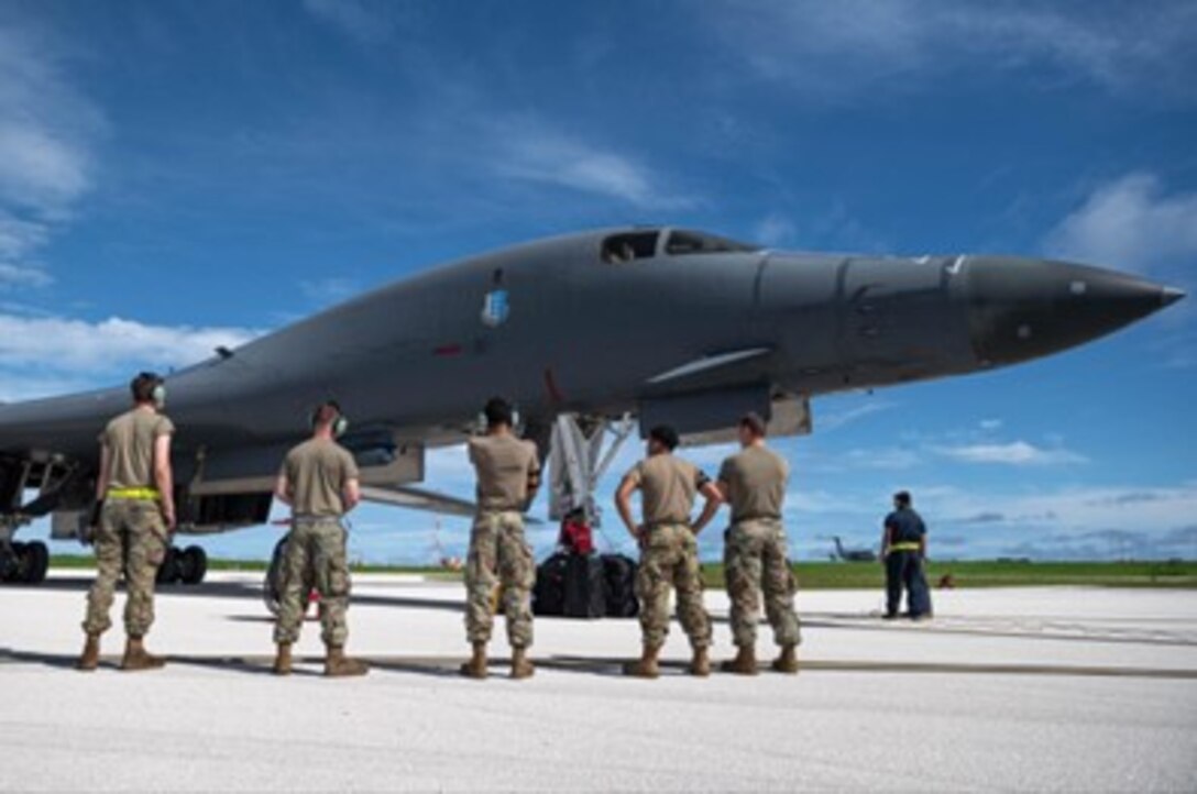 Airmen assigned to the 28th Bomb Wing receive a U.S. Air Force B-1B Lancer assigned to the 37th Expeditionary Bomb Squadron, Ellsworth Air Force Base, South Dakota, after landing at Andersen Air Force Base, Guam, in support of a Bomber Task Force mission, Oct. 18, 2022. Bomber missions contribute to joint force lethality and deter aggression in the Indo-Pacific by demonstrating the U.S. Air Force’s ability to operate anywhere in the world at any time in support of the National Defense Strategy. (U.S. Air Force photo by Senior Airman Yosselin Campos)