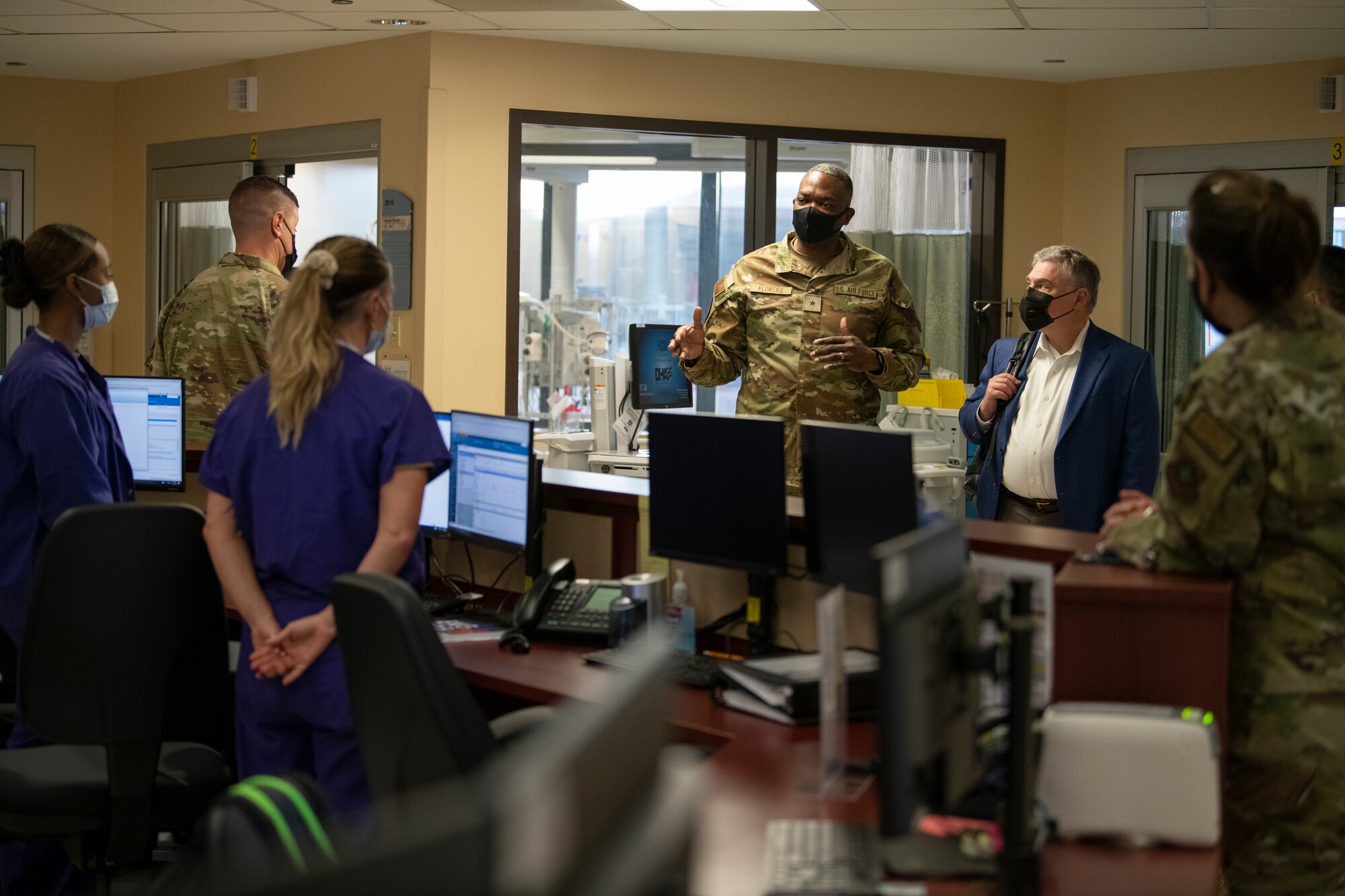 U.S. Air Force Brig. Gen. Alfred K. Flowers, Jr., center, meet with Airmen in the intensive care unit at David Grant USAF Medical Center, Travis Air Force Base, California, Oct. 12, 2022.