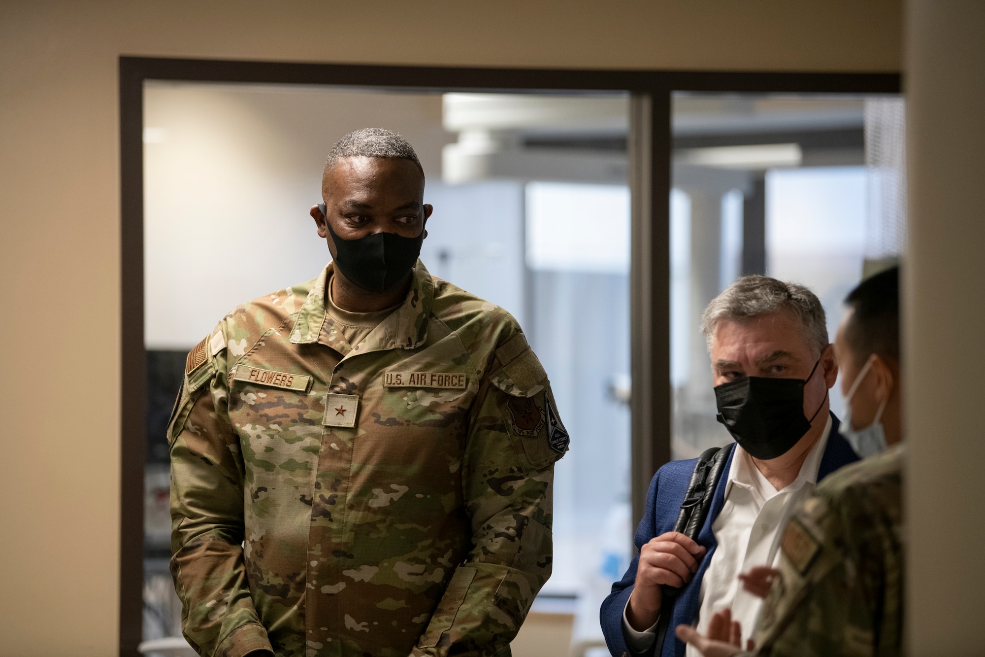 U.S. Air Force Brig. Gen. Alfred K. Flowers, left, receives a brief from an Airman, at David Grant USAF Medical Center, Travis Air Force Base, California, Oct. 12, 2022.