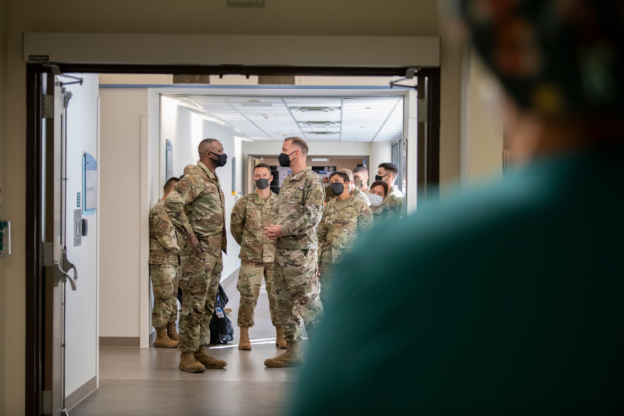 A group of Airmen stand in the hallway at David Grant USAF Medical Center, Travis Air Force Base, California, Oct. 12, 2022