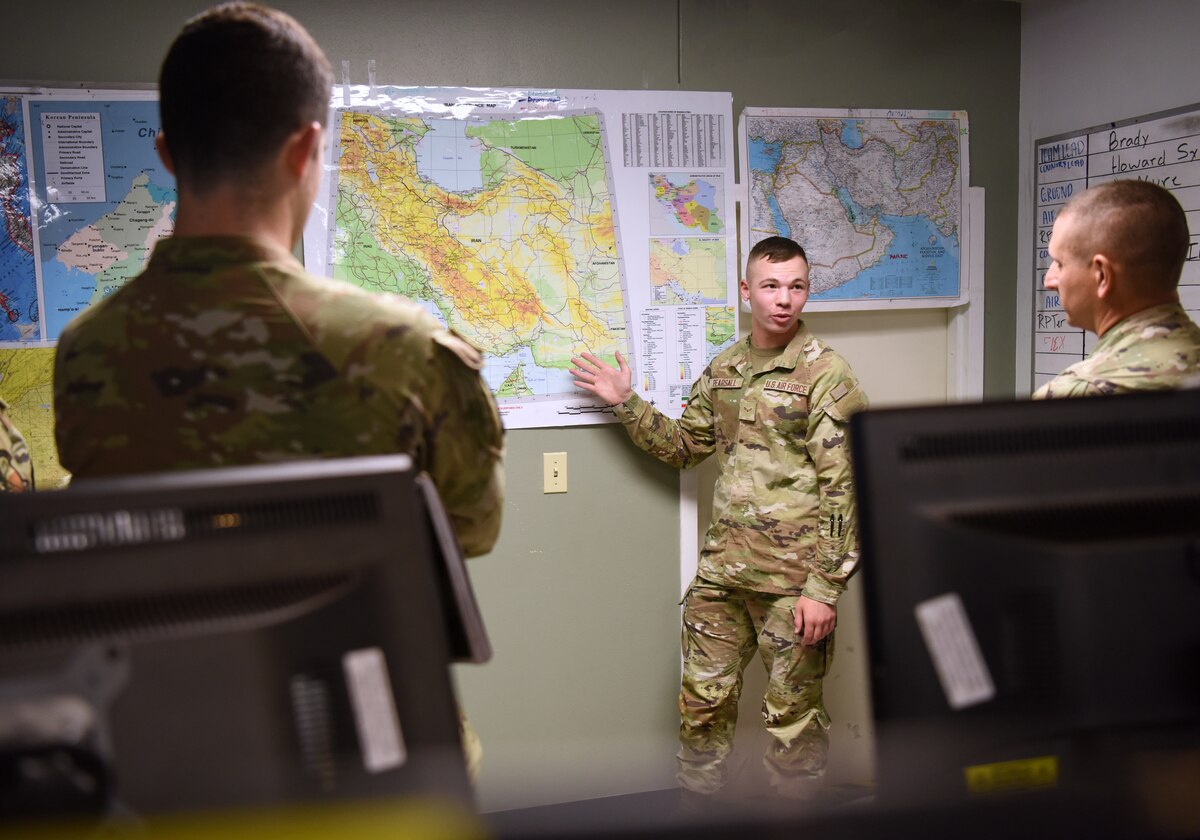 U.S. Air Force Airman 1st Class Alexander Pearsall, 316th Training Squadron student, conducts an unclassified brief in a simulated joint operations center for his capstone exercise, Operation Loneshark, at Goodfellow Air Force Base, Texas, Oct. 11, 2022. This learning environment is a joint intelligence exercise that includes students from the Space Force, Marine Corps and Air Force. (U.S. Air Force photo by Senior Airman Abbey Rieves)