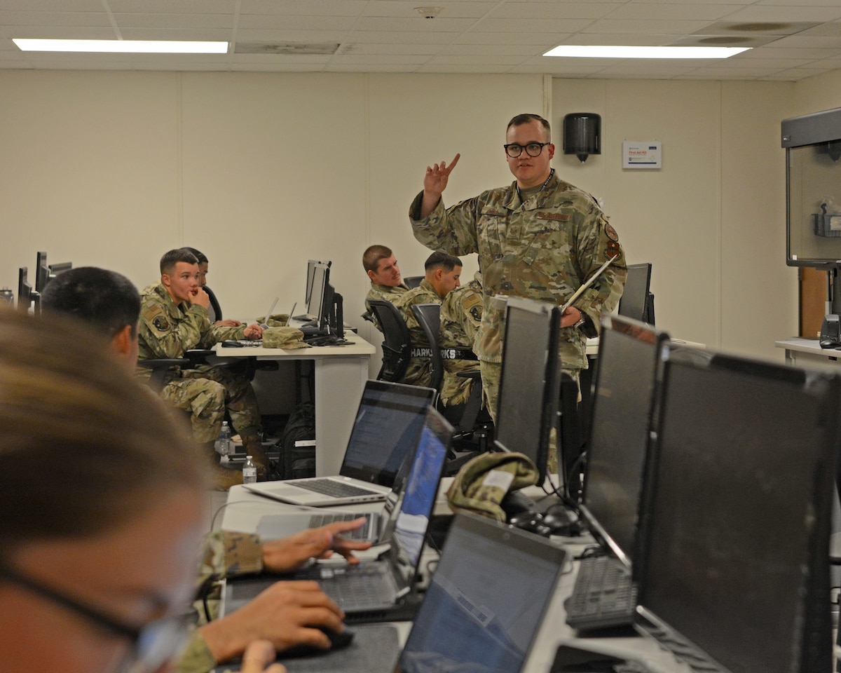 U.S. Air Force Staff Sgt. Caleb Elsea, 316th Training Squadron instructor, teaches a computer networking class, at Goodfellow Air Force Base, Texas, October 6, 2022. Elsea taught the students how to extract host addresses from an IP address. (U.S. Air Force photo by Senior Airman Abbey Rieves)