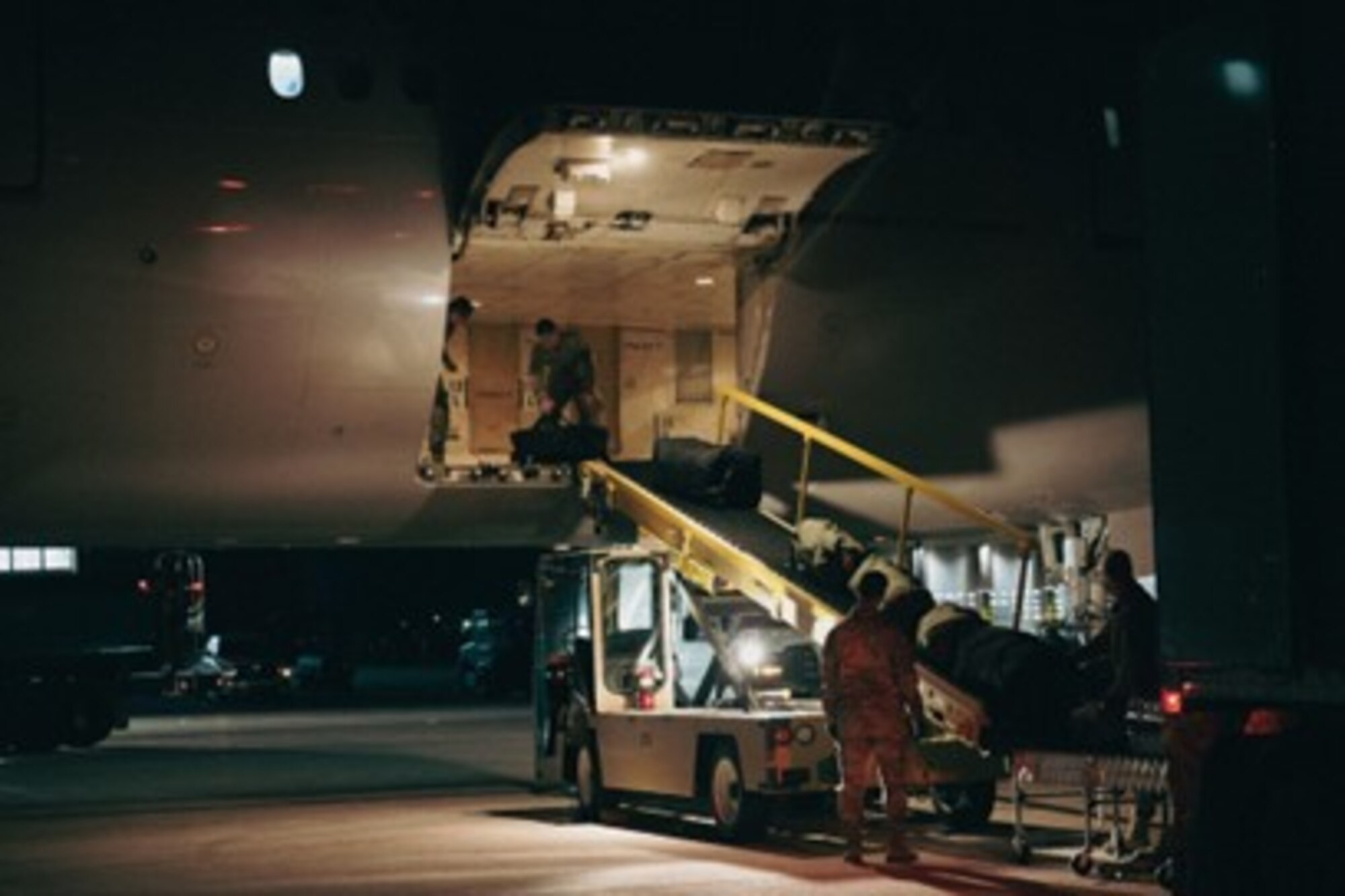 U.S. Airmen assigned to the 28th Logistics Readiness Squadron load equipment to a Boeing 777 for a Bomber Task Force operation at Ellsworth Air Force Base, South Dakota, on Oct 14, 2022. The U.S. Indo-Pacific Command routinely and visibly demonstrates commitment to our allies and partners through the global employment of our military forces. (U.S. Air Force photo by Senior Airman Austin McIntosh)