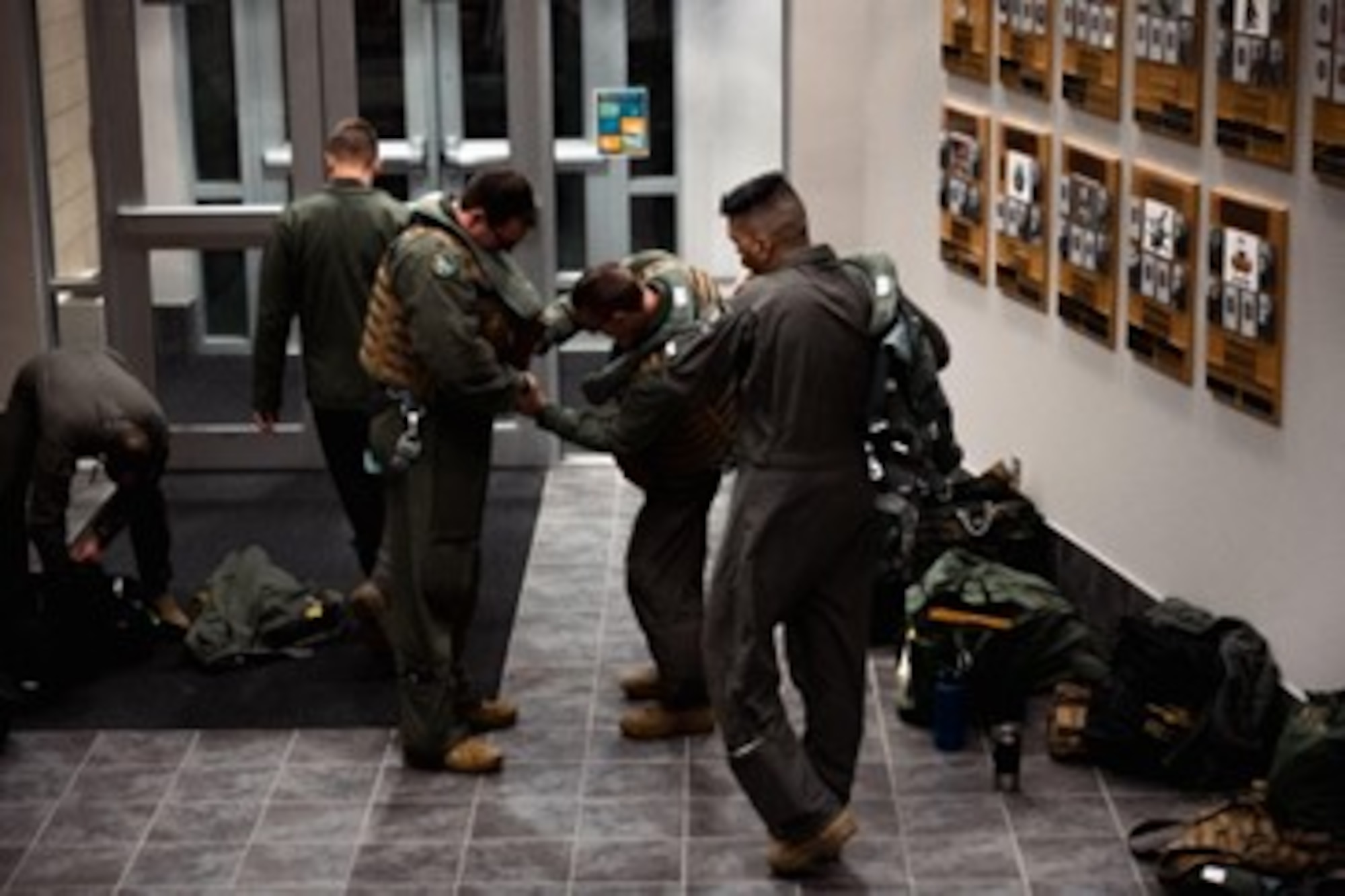 U.S. Air Force B-1B Lancer aircrew members assigned to the 37th Bomb Squadron, don aircrew flight equipment prior to departing on a Bomber Task Force operation at Ellsworth Air Force Base, South Dakota, on Oct. 17, 2022. Strategic bomber missions enhance the readiness and training necessary to respond to any potential crisis or challenge across the globe. (U.S. Air Force photo by Senior Airman Austin McIntosh)