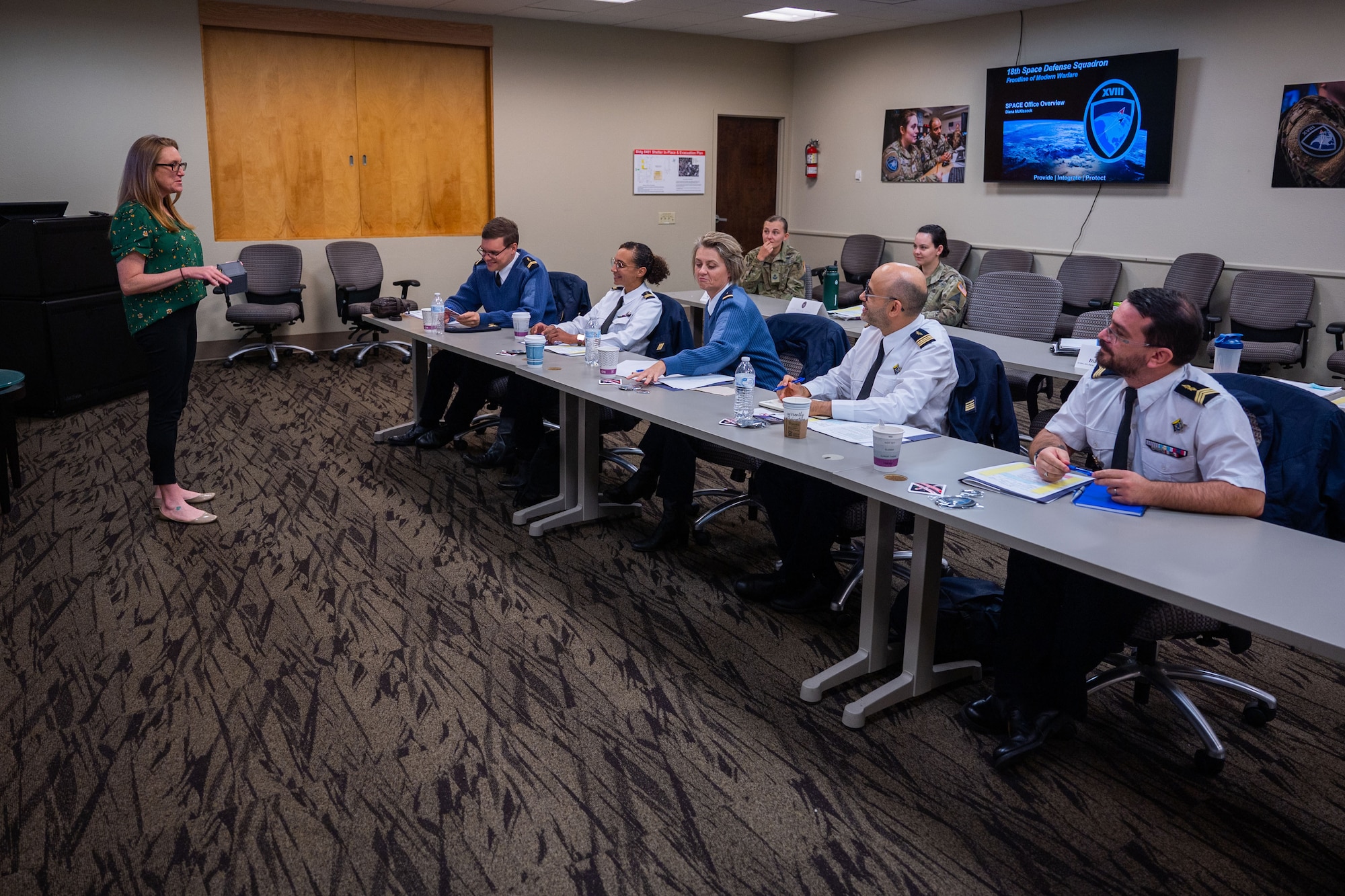 Diana McKissock, Space Situational Awareness Partnership and Coalition Engagement (SPACE) office lead and member of the 18th Space Defense Squadron (18 SDS), left, instructs French space operators from the Operational Center for Military Surveillance of Space Objects (COSMOS) during an Operator Exchange at Vandenberg Space Force Base, Calif., Oct. 5, 2022. The 18 SDS executes U.S. Space Command’s Space Domain Awareness (SDA) mission, including command and control of the U.S. Space Surveillance Network, and is also responsible for the SSA Sharing program, which provides data of resident space objects to commercial, international and academic partners. (U.S. Space Force photo by Tech. Sgt. Luke Kitterman)
