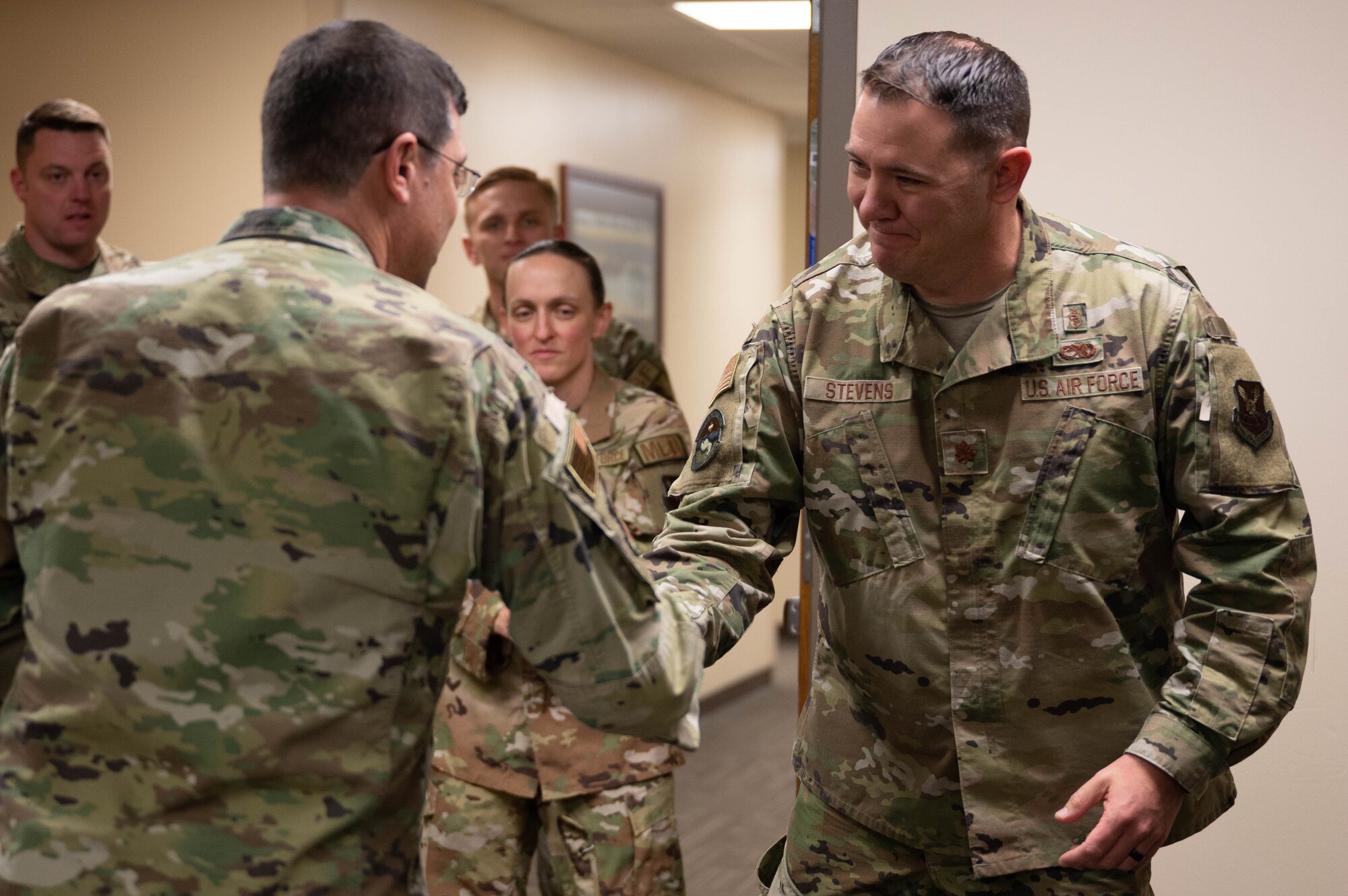 Maj. Charlie Stevens, assigned to the 28th Bomb Wing, receives a coin from Maj. Gen. Andrew Gebara, 8th Air Force and Joint-Global Strike Operations Center commander, at Ellsworth Air Force Base, S.D., Oct. 17, 2022. Coining’s are traditionally used to reward and recognize service members for their exceptional work inside and outside of the workplace. (U.S. Air Force photo by Staff Sgt. Alexi Bosarge)