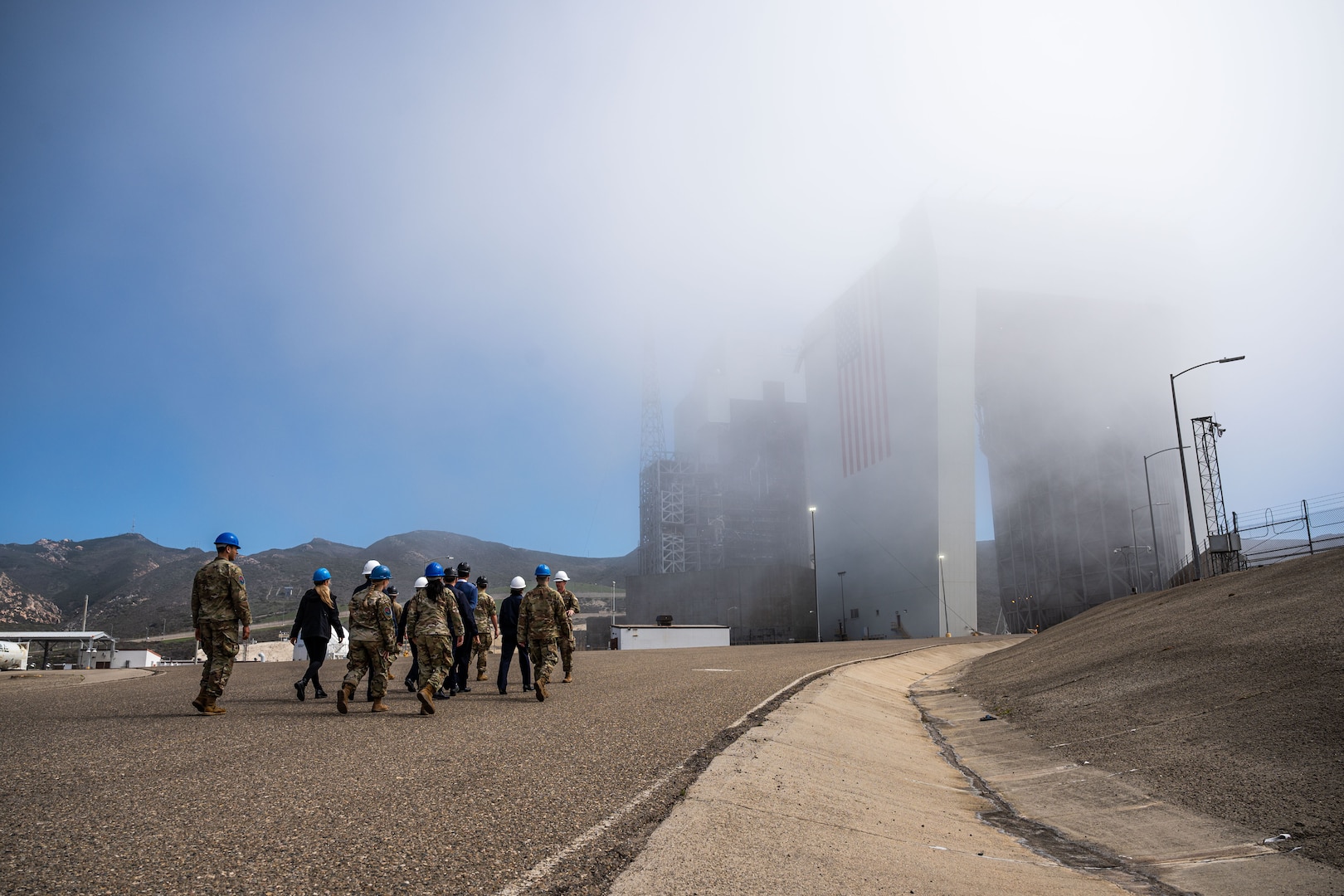 Members from the 18 Space Defense Squadron (18 SDS), France’s Operational Center for Military Surveillance of Space Objects (COSMOS), and the 2nd Space Launch Squadron conduct a tour of Space Launch Complex-6 during an Operator Exchange event, hosted by the 18 SDS, at Vandenberg Space Force Base, Calif. Oct. 6, 2022. The 4-day exchange aimed to advance global space domain awareness between the two groups by exchanging common practices, spotlighting mission capabilities, and explaining methodologies of their respective programs.  (U.S. Space Force phot by Tech. Sgt. Luke Kitterman)