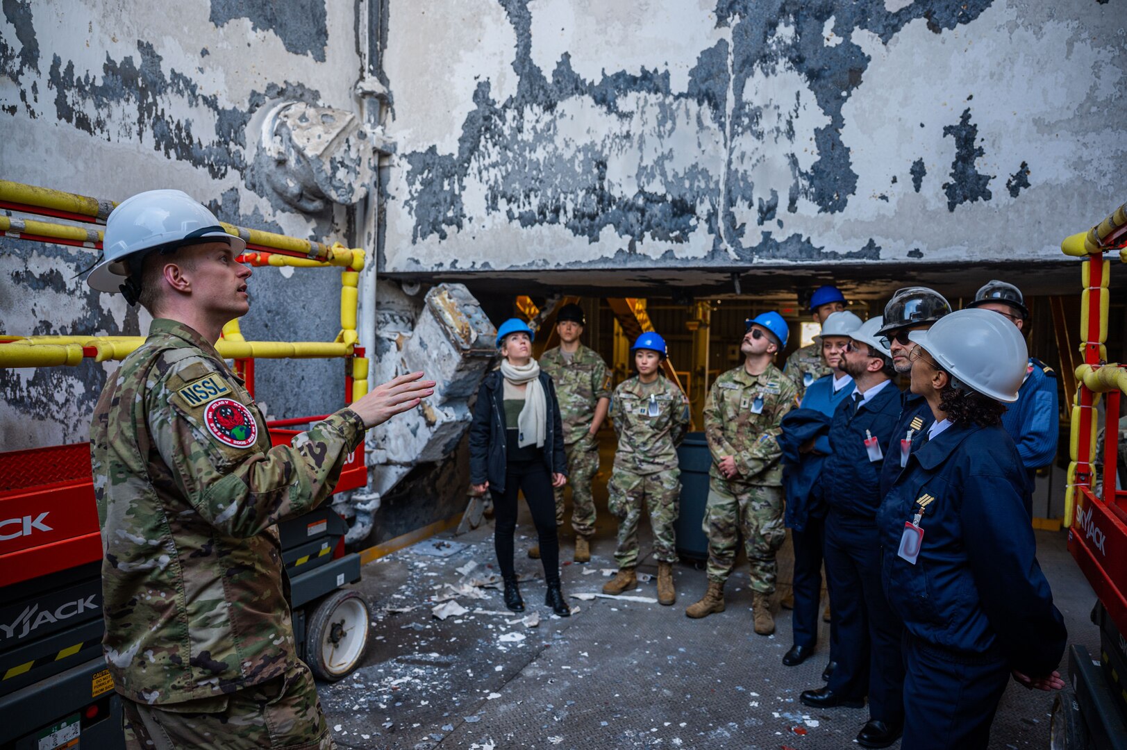 U.S. Space Force 2nd Lt. Brady Pudwill, 2nd Space Launch Squadron responsible engineer, provides information to members from the 18 Space Defense Squadron and France’s Operational Center for Military Surveillance of Space Objects (COSMOS) during a tour of Space Launch Complex-6 at Vandenberg Space Force Base, Calif. Oct. 6, 2022. The 4-day event aimed to advance global space domain awareness between the two groups by exchanging common practices, spotlighting mission capabilities, and explaining methodologies of their respective programs. (U.S. Space Force phot by Tech. Sgt. Luke Kitterman)