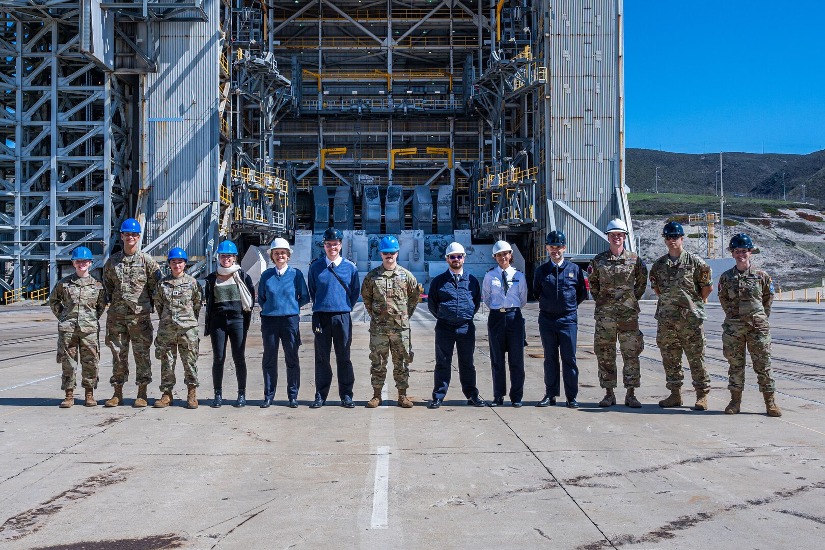 Members from the 18 Space Defense Squadron (18 SDS), France’s Operational Center for Military Surveillance of Space Objects (COSMOS), and the 2nd Space Launch Squadron conduct a tour of Space Launch Complex-6 during an Operator Exchange event, hosted by the 18 SDS, at Vandenberg Space Force Base, Calif. Oct. 6, 2022. The 4-day event aimed to advance global space domain awareness between the two groups by exchanging common practices, spotlighting mission capabilities, and explaining methodologies of their respective programs. (U.S. Space Force phot by Tech. Sgt. Luke Kitterman)