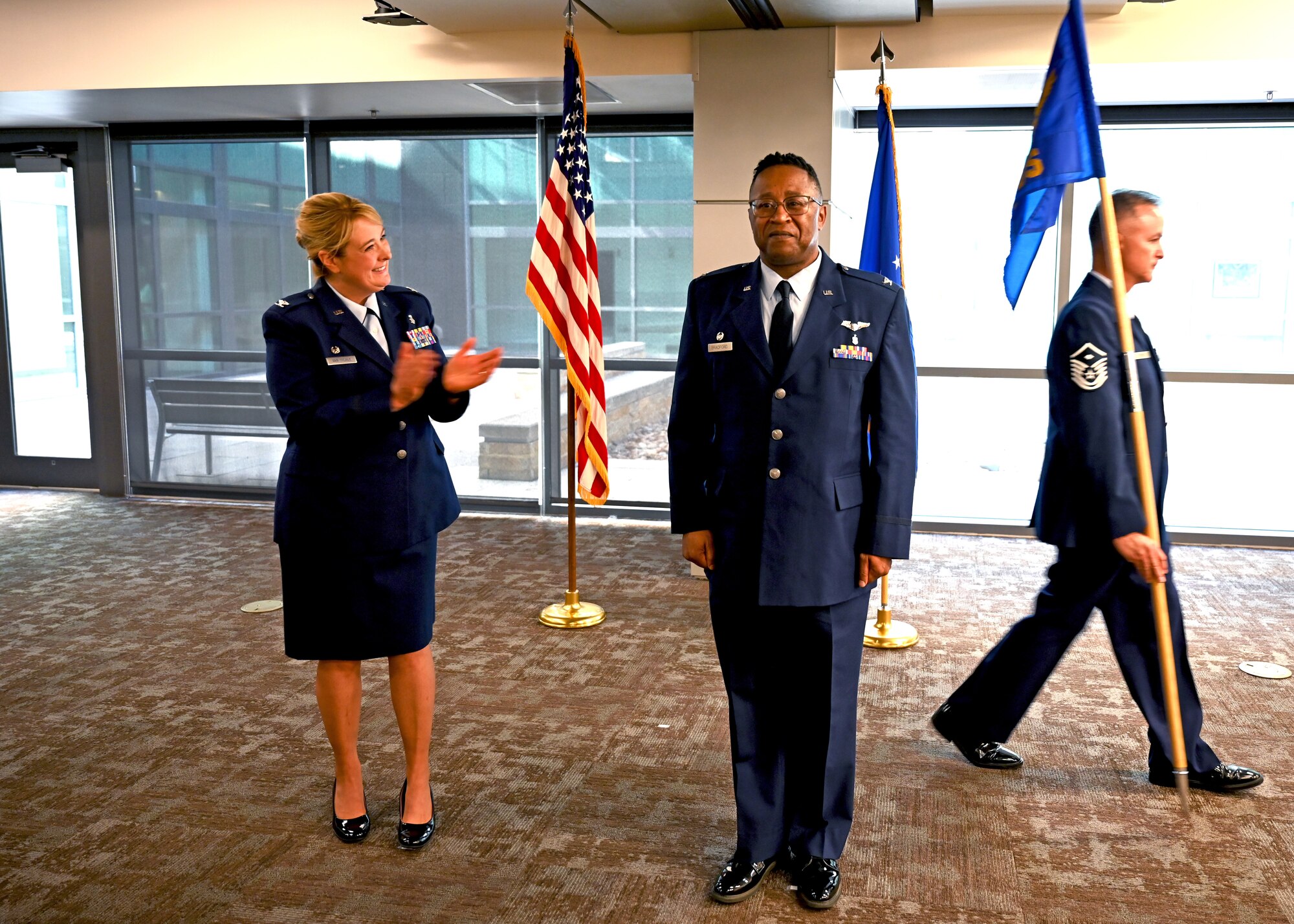 Col. Michelle Van Sickle, 433rd Medical Group commander, claps during the 433rd Medical Squadron assumption of command ceremony Oct. 16, 2022, where Col. Alvin Bradford assumed command, Joint Base San Antonio-Lackland, Texas. (U.S. Air Force photo by Staff Sgt. Monet Villacorte)