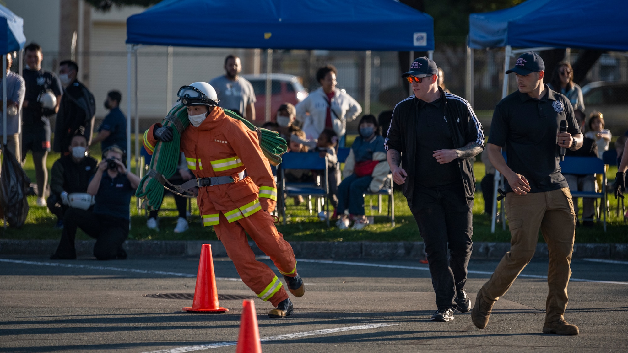 Competitor carry an object during one of the competitions at the annual Fire Muster.