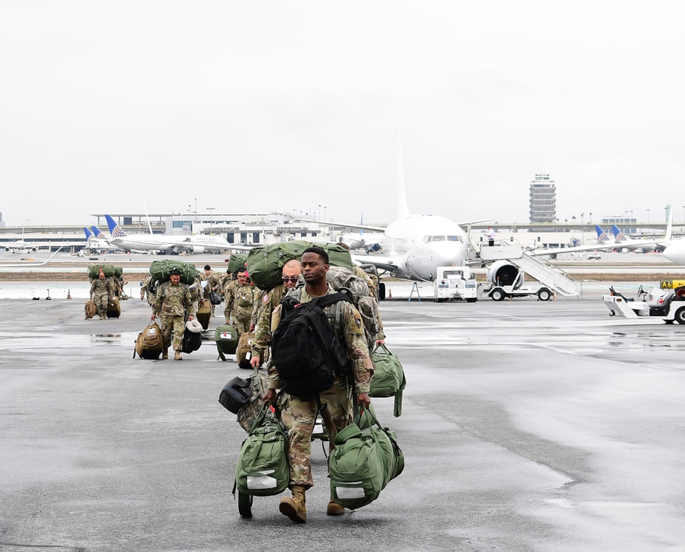 Soldiers from the California National Guard’s San Bernardino-based 1-185th Infantry Regiment arrive at Los Angeles International Airport Oct. 15, 2022, after a one-year deployment to Poland to support the NATO alliance.