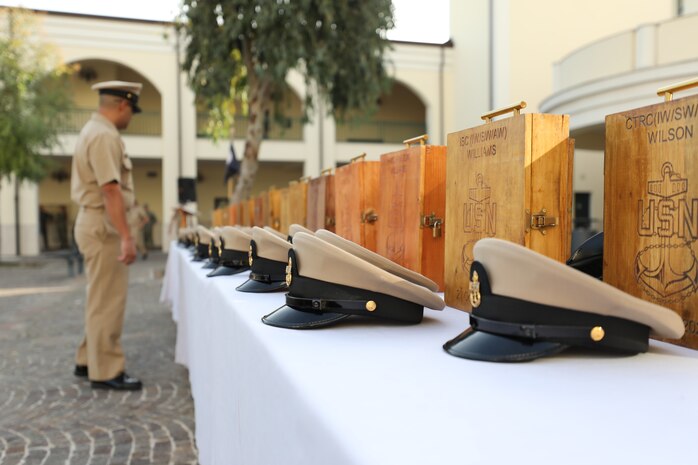 Newly-pinned Chief Petty Officers participate in a Chief Petty Officer pinning ceremony at the Naval Support Activity (NSA) Naples Chapel, Oct. 21, 2022.