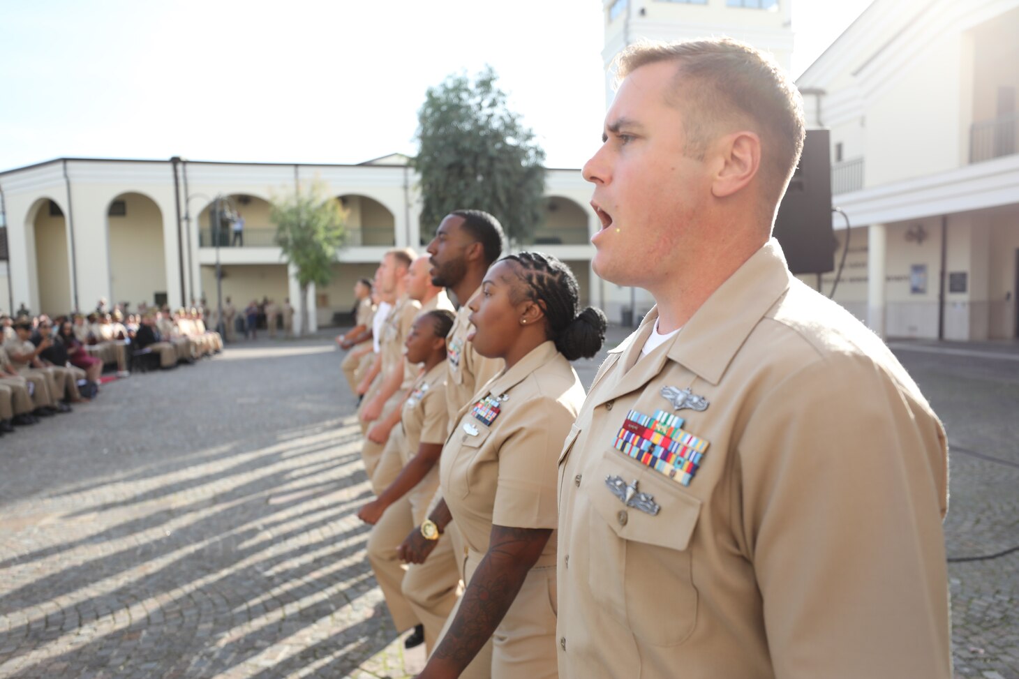 Newly-pinned Chief Petty Officers participate in a Chief Petty Officer pinning ceremony at the Naval Support Activity (NSA) Naples Chapel, Oct. 21, 2022.