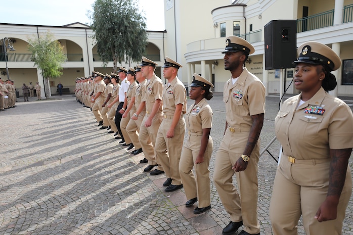Newly-pinned Chief Petty Officers participate in a Chief Petty Officer pinning ceremony at the Naval Support Activity (NSA) Naples Chapel, Oct. 21, 2022.