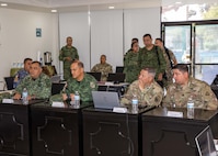 Mexican army General De Brigada (Maj. Gen.) Roberto Claudio del Rosal Ibarra, the 8th Military Zone commander, second from left, and Joint Task Force Civil Support commanding general, U.S. Army Maj. Gen. Jeffrey Van, second from right, attend a briefing during exercise Fuerzas Amigas 2022 at Campo Militar Reynosa, Mexico, Oct. 19, 2022.