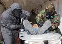 U.S. Soldiers assigned to the 526th Engineer Company, 92nd Engineer Battalion, 20th Engineer Brigade, from Fort Stewart, Ga., and Mexican army soldiers assigned to the 19th Motorized Cavalry Regiment decontaminate a simulated casualty after pulling them from an area with chemical, biological, radiological or nuclear contamination during exercise Fuerzas Amigas 2022 at Campo Militar Reynosa, Mexico, Oct. 19, 2022.