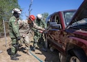 U.S. Soldiers assigned to the 526th Engineer Company, 92nd Engineer Battalion, 20th Engineer Brigade, from Fort Stewart, Ga., and Mexican army soldiers assigned to the 19th Motorized Cavalry Regiment extract a simulated casualty from a vehicle using the Jaws of Life during search-and-rescue training as part of exercise Fuerzas Amigas 2022 at Campo Militar Reynosa, Mexico, Oct. 19, 2022.