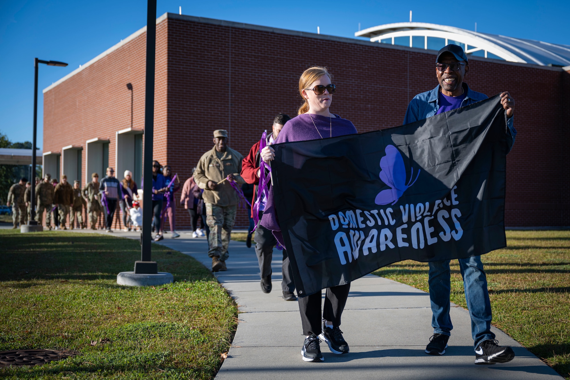 Airmen assigned to the 4th Fighter Wing participate in a domestic violence awareness march at Seymour Johnson Air Force Base, North Carolina, Oct. 20, 2022. This year’s theme for Domestic Violence Awareness Month is “Breaking the Silence.”