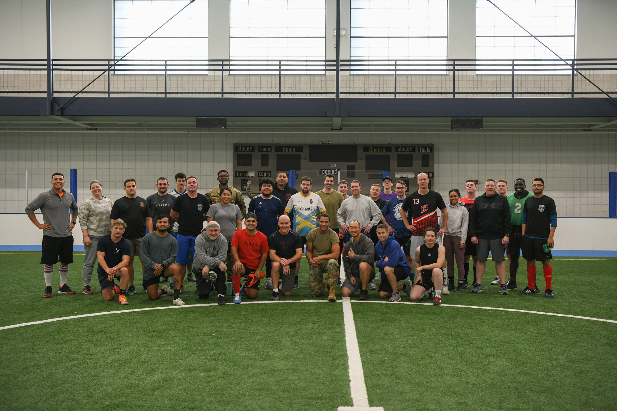 Members of the 319th Reconnaissance Wing pose for a photo Oct. 17, 2022, following the griffin challenge games at the fitness center field house on Grand Forks Air Force Base, North Dakota. The griffin challenge games are competition events between airmen and base leadership meant to boost morale and build camaraderie. (U.S. Air Force photo by Senior Airman Ashley Richards)
