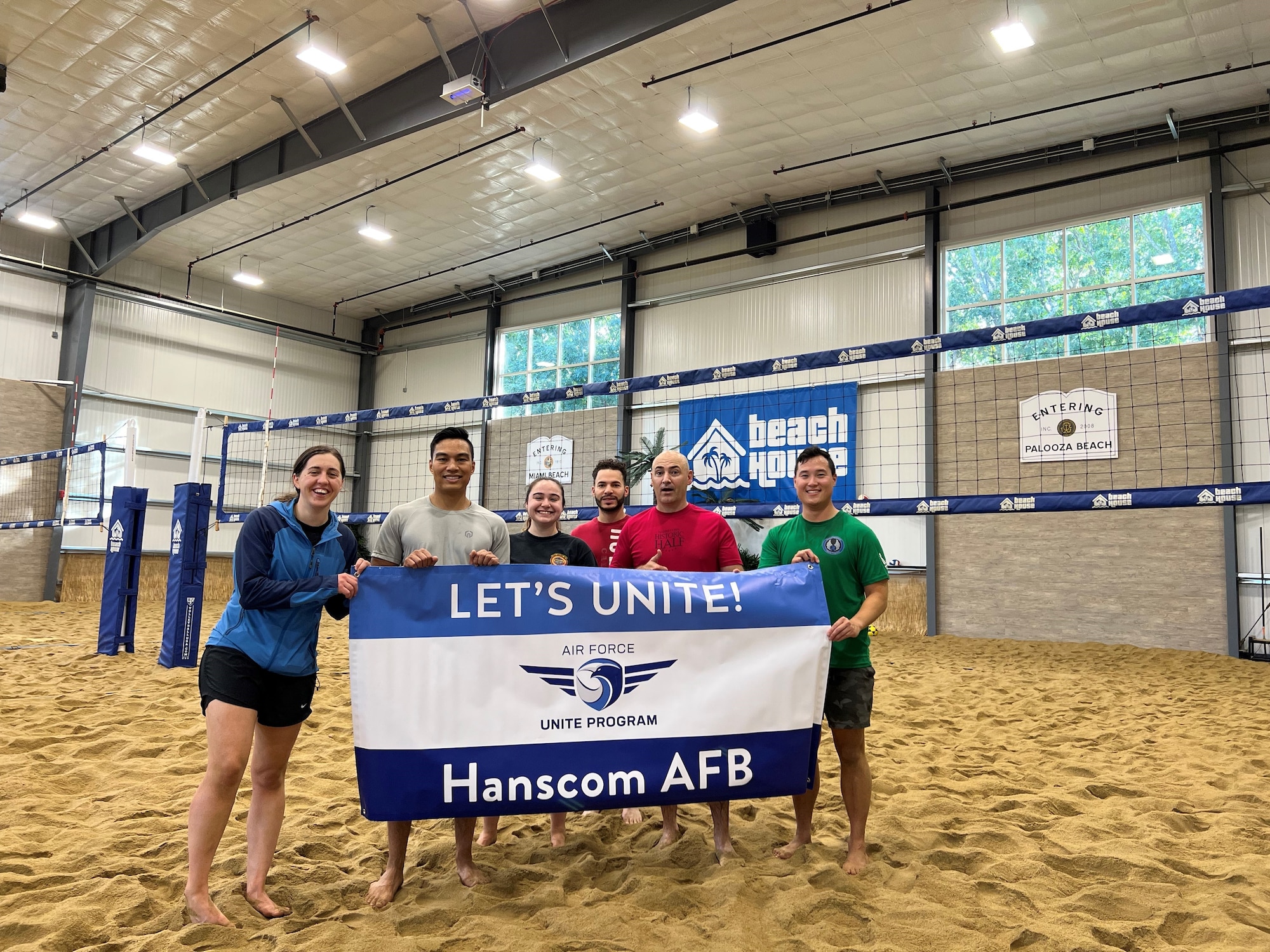 Members participating in a UNITE event, indoor beach volleyball, cohesion event