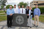 Naval Surface Warfare Center, Philadelphia Division and Rowan University present collaborative research on the development of di-electric materials for cryogenic applications to the Naval Engineering Education Consortium (NEEC) during NEEC Day 2022 at the Naval Undersea Warfare Center Division in Newport, R.I. on June 15, 2022. Pictured: Steve Mastro, deputy chief technology officer (CTO), NSWCPD; Aaron Haines, Jacob Mahon, Nicholas Mahon from Rowan University; Mark Stitch from Temple University; Professor Wei Xue from Rowan University; and Andrew Smith from Penn State University. (U.S. Navy Photo by David Stoehr/Released)