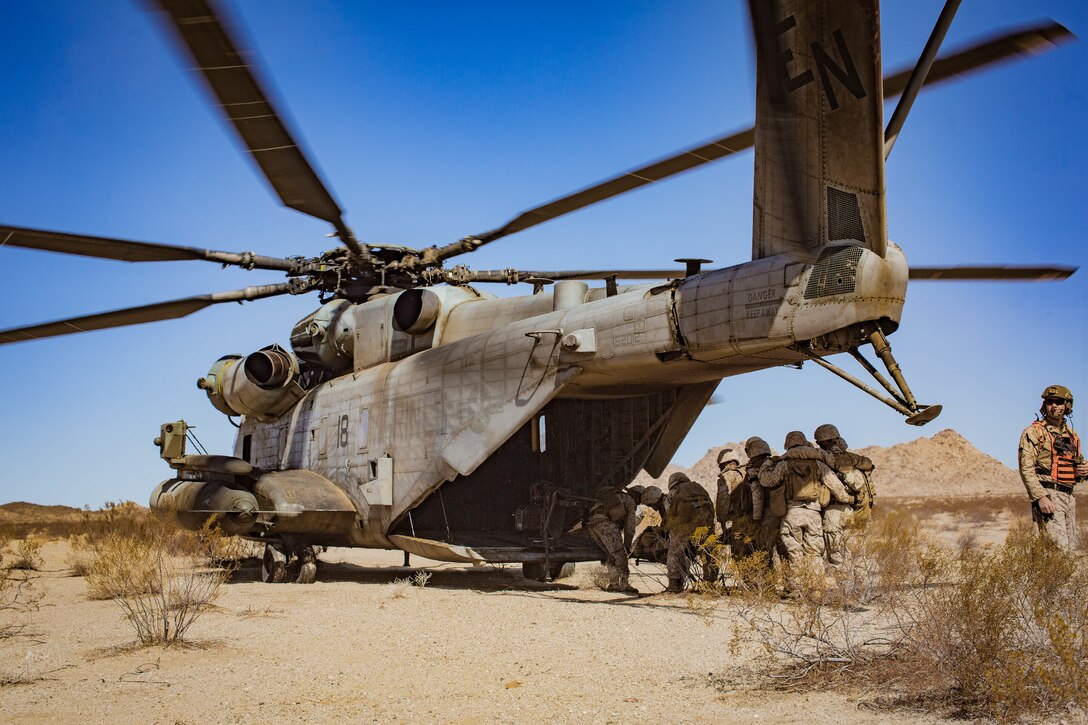 U.S. Marines with Combat Logistics Battalion 1, Combat Logistics Regiment 1, 1st Marine Logistics Group, carry a simulated casualty to a CH-53 Super Stallion with Marine Heavy Helicopter Squadron HMH-464 during the Integrated Training Exercise 3-22 on Marine Air Ground Combat Center Twentynine Palms, California April 16, 2022. ITX is a live-fire event that increases unit readiness. It teaches the tactical application of combined-arms maneuver as well as offensive and defensive operations during combat. (U.S. Marine Corps photo by Cpl. Kevin N. Seidensticker)