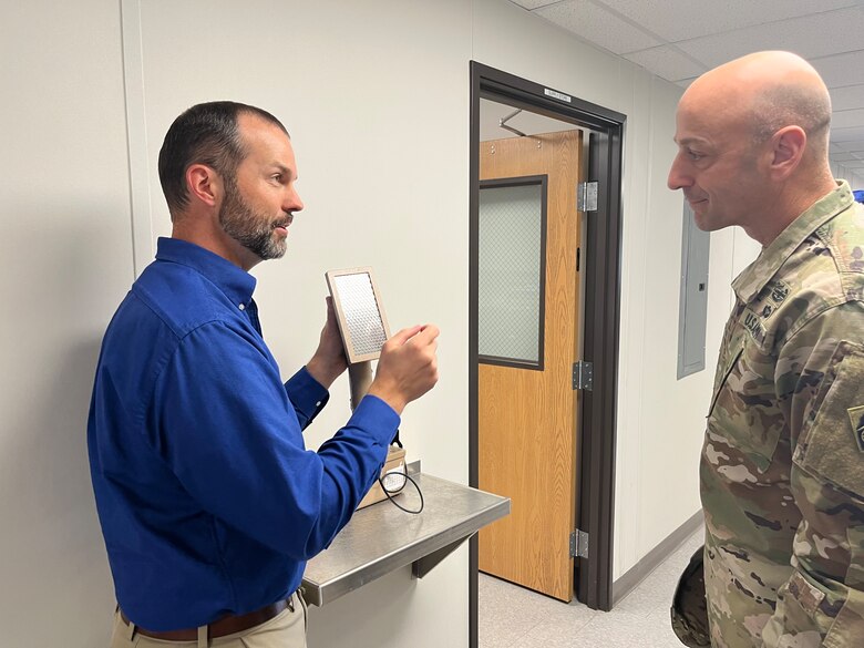 USACE Commanding General Lt. Gen. Scott Spellmon and USACE St. Louis District Formerly Utilized Sites Remedial Action Program Manager Phil Moser review some of the equipment that experts will use during their expanded testing of the entire Jana Elementary School property. Samples they plan to take include soil samples and structure surveys both inside and outside of the school. Testing will begin Monday, Oct. 24, and preliminary results will be available within two weeks. (US Army Photo by Maj. Grace Geiger)