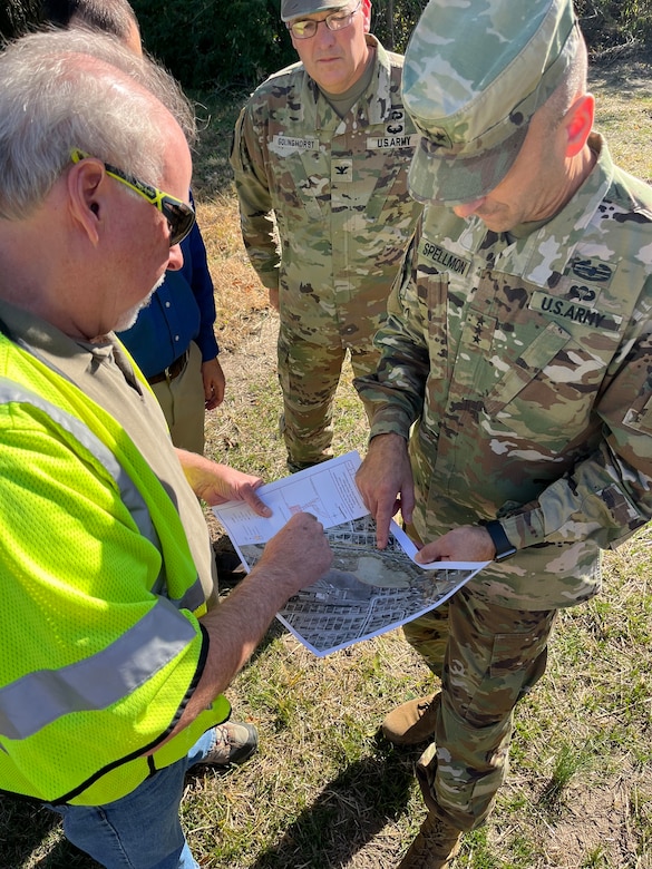 USACE Commanding General Lt. Gen. Scott Spellmon and his St. Louis District experts tour the grounds of Jana Elementary School near Coldwater Creek Oct. 21, as they prepare to expand sampling of the entire school property. Sampling will include soil samples and structure surveys both inside and outside the school. Testing will begin Monday, Oct. 24, and preliminary results will be available within two weeks. (US Army Photo by Maj. Grace Geiger)