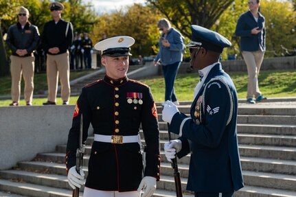 U.S. Marine Corps Cpl. Landon Johnson of the Marine Corps Silent Drill Platoon and U.S. Air Force Senior Airman Christian Porter of the U.S. Air Force Honor Guard Drill Team were high school classmates and reconnected after their performances at the Joint Services Drill Exhibition at the Lincoln Memorial Plaza, Washington, D.C., Oct. 19, 2022. (U.S. Air Force photo by Kristen Wong)