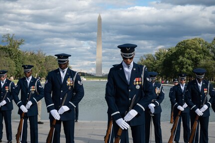 The U.S. Air Force Honor Guard Drill Team concludes a performance at the Joint Services Drill Exhibition at the Lincoln Memorial Plaza, Washington, D.C., Oct. 19, 2022. The event brought together drill teams from the U.S. Air Force, Army, Navy, Marine Corps and Coast Guard to compete for the most superlative display of precision, discipline and teamwork. (U.S. Air Force photo by Kristen Wong)