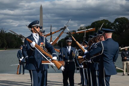 U.S. Air Force Senior Master Sgt. Antonio Lofton of the U.S. Air Force Honor Guard Drill Team walks through the gauntlet during a performance at the Joint Services Drill Exhibition at the Lincoln Memorial Plaza, Washington, D.C., Oct. 19, 2022. The Drill Team is an elite unit compromising of 25 Airmen who train, on average, five days a week for eight to ten hours per day to obtain their level of mastery. (U.S. Air Force photo by Kristen Wong)