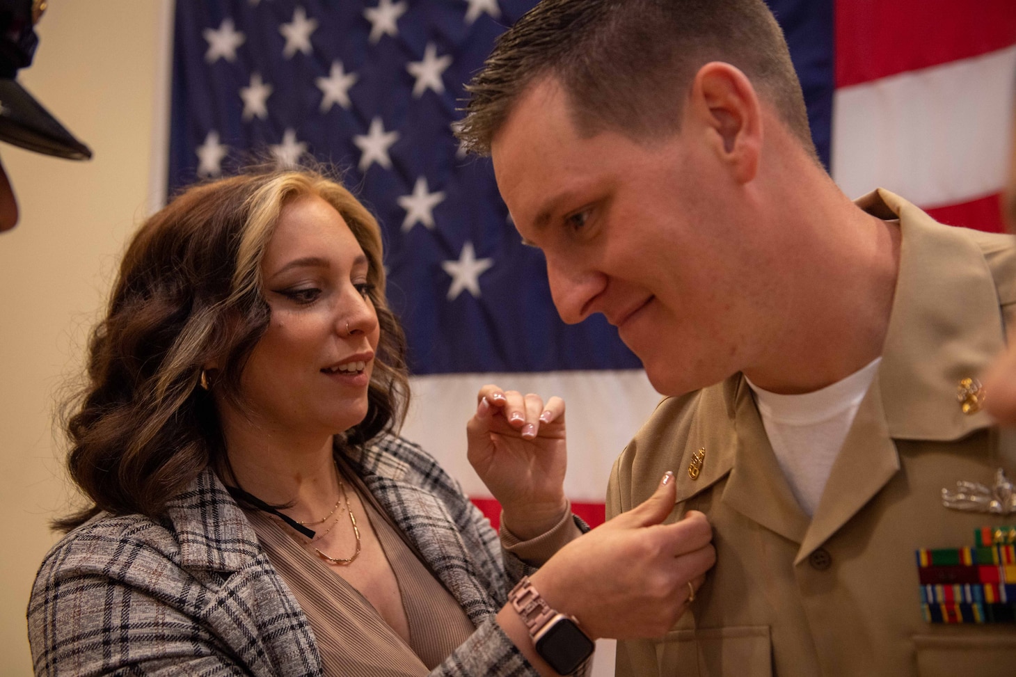 NAVAL STATION NORFOLK (Oct. 21, 2022) Family members and mentors pin Chief Fire Controlman (Aegis) Stormy Wofford’s anchors during the Naval Surface Force Atlantic chief petty officer pinning ceremony onboard Naval Station Norfolk, Oct. 21. Nine Sailors received their gold-fouled anchors during the ceremony. (U.S. Navy photo by Mass Communication Specialist 1st Class Jacob Milham)