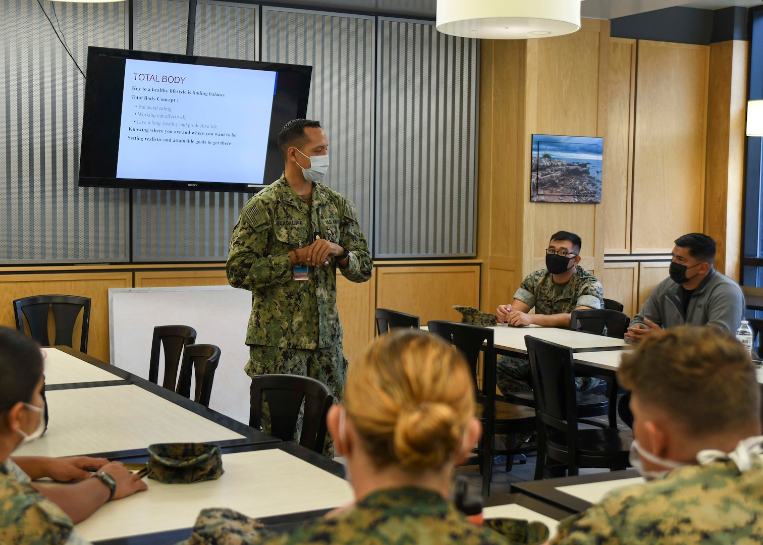 U.S. Navy Lieutenant Commander Nelson H. Guadalupe, department head for Naval Medical Center Camp Lejeune's Nutrition Management Department conducts a Performance and Weight Management Sports Nutrition class to an audience of Marines and Sailors.