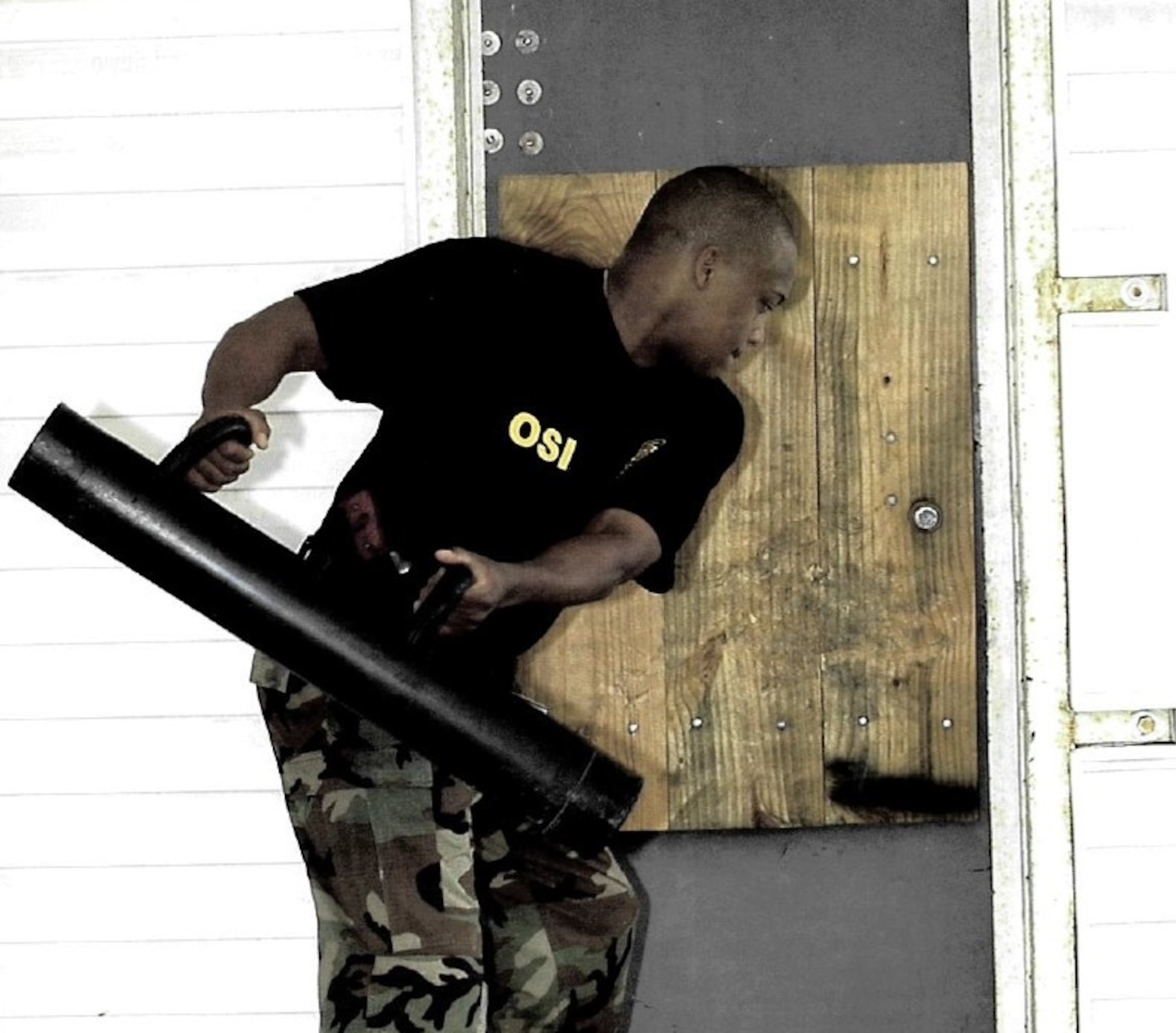 An Air Force Special Investigations Academy Class 301 member conducts “Dynamic Entry” training at the Federal Law Enforcement Training Center, Glynco, Ga.(U.S. Air Force photo)