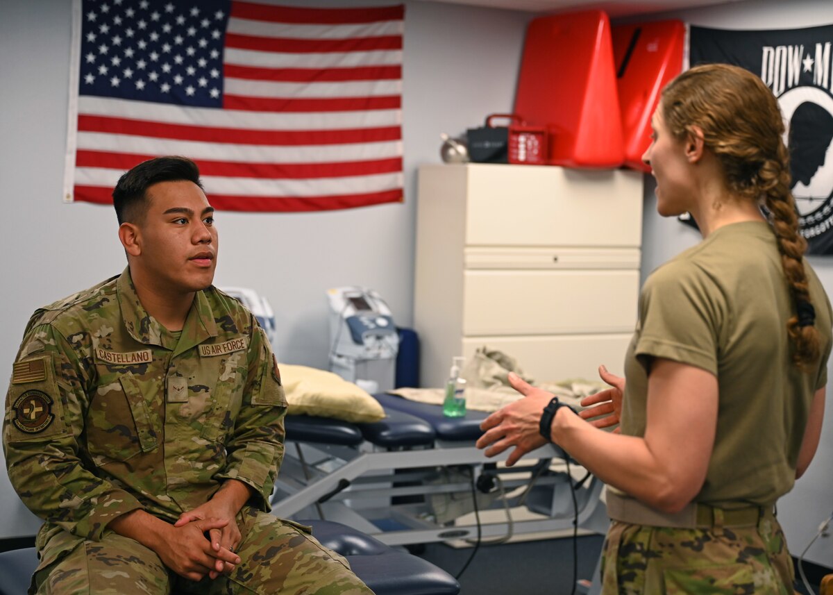 U.S. Air Force Capt. Andrea Shefferly, 17th Operational Medical Readiness Squadron physical therapy and optometry flight commander, discusses running form with Airman Jason Castellano, 17th Healthcare Operations Squadron medical logistics technician, at the Ross Clinic, Goodfellow Air Force Base, Texas, Sept. 21, 2022. Shefferly sees patients for various reasons, from sports injuries to sore necks. (U.S. Air Force photo by Senior Airman Ethan Sherwood)