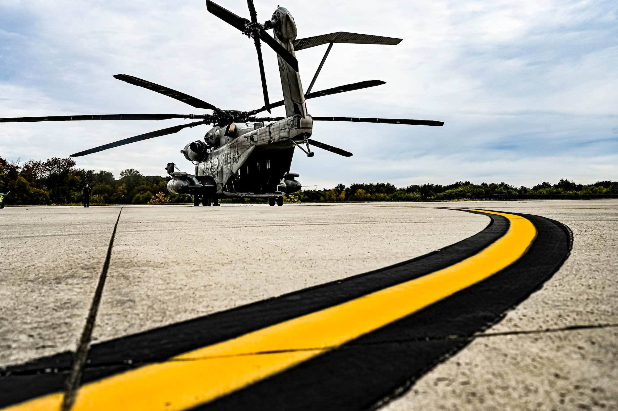 A CH-53E assigned to Marine Aircraft Group 49 prepares to upload at Joint Base McGuire-Dix-Lakehurst, N.J. on Oct. 16, 2022. Defenders with 87th SFS K-9 section took part in a joint training with Marines to familiarize the Military Working Dogs with the transportation by helicopter. This skillset was developed for the qualification purposes of bomb detection in deployed environments, where certain terrain may only be accessible by air transportation.