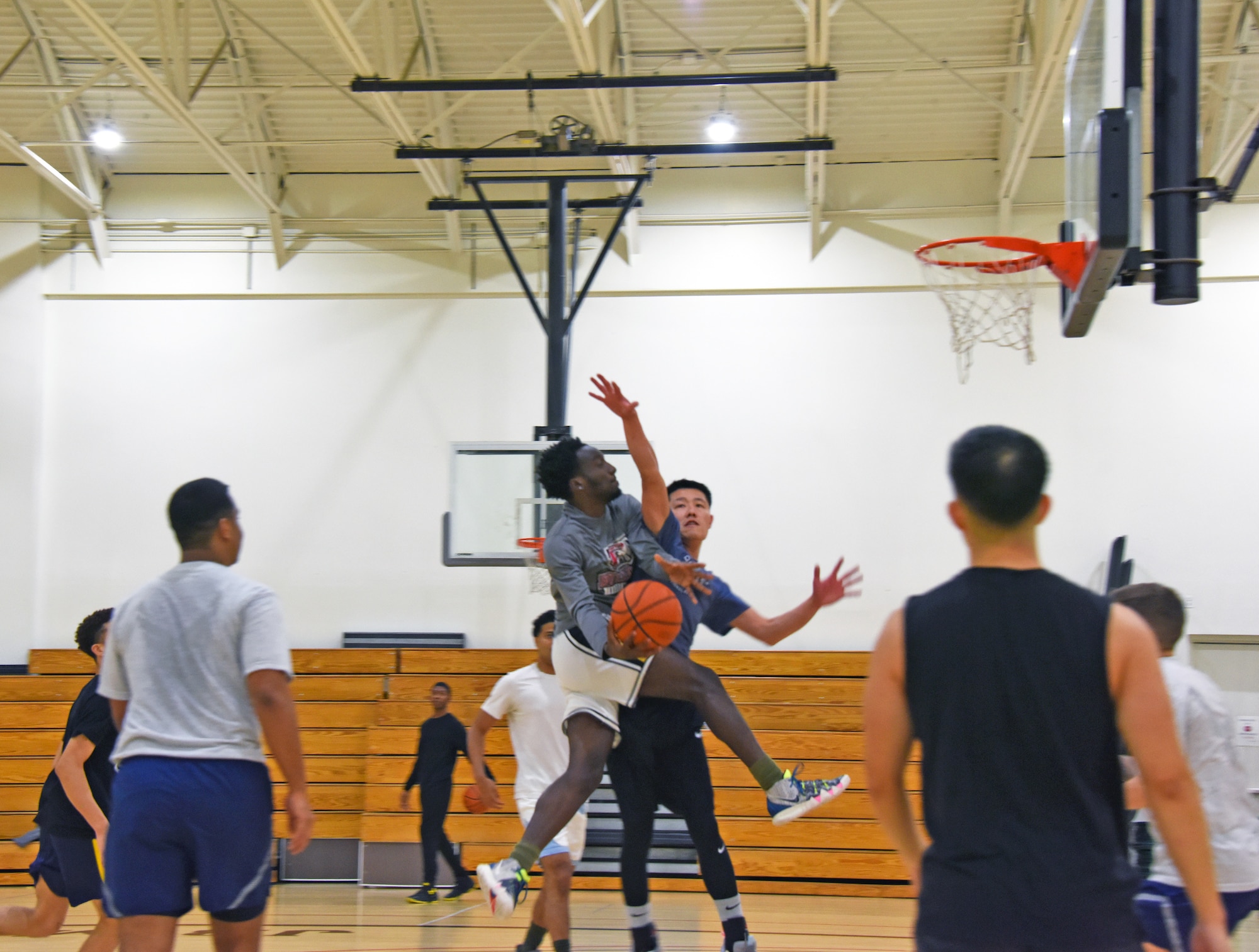 A participant makes a lay-up shot.